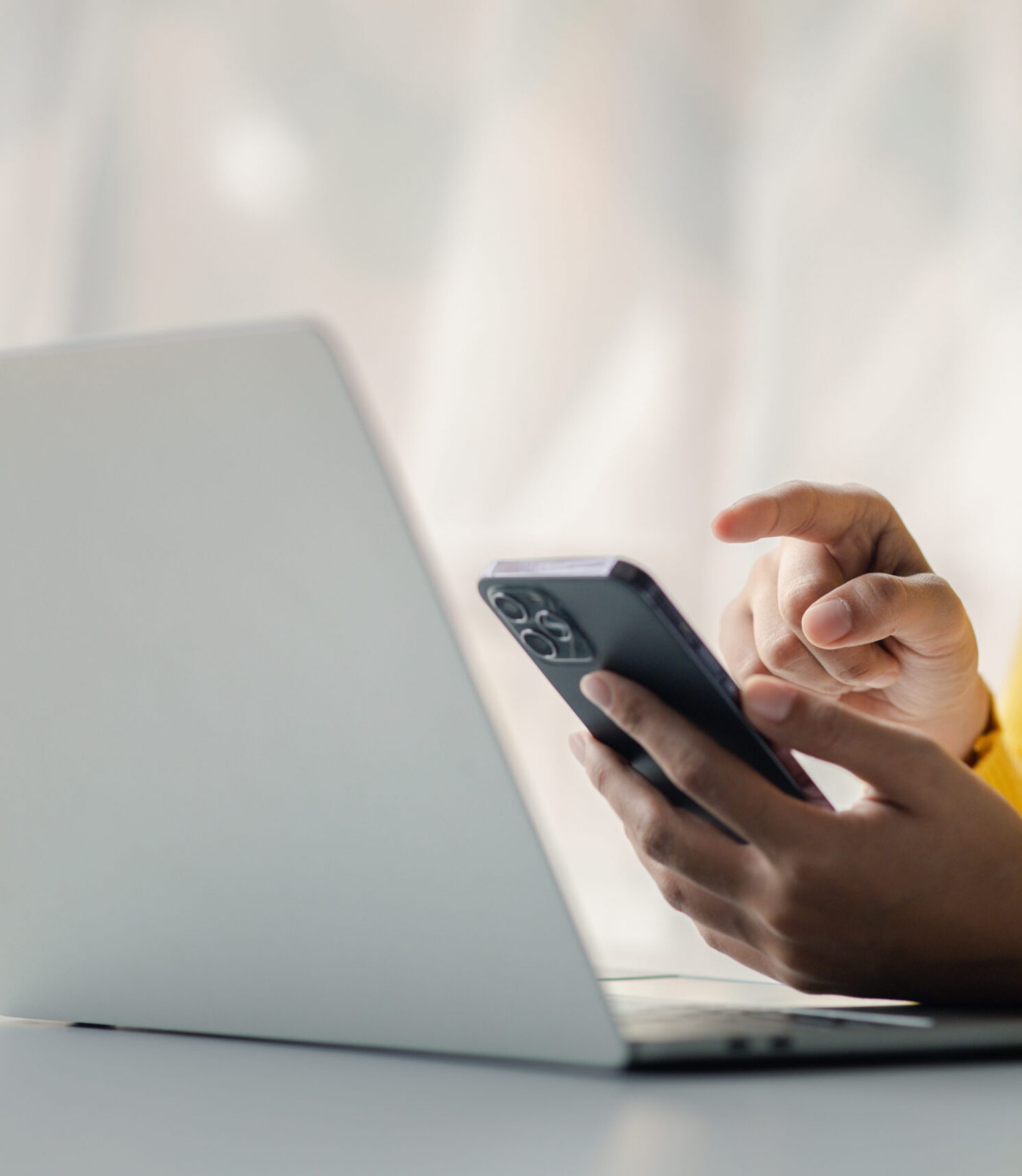 A person holds a mobile phone to use social media on a smartphone, communicating via the Internet on a smartphone. The concept of using technology in communication.